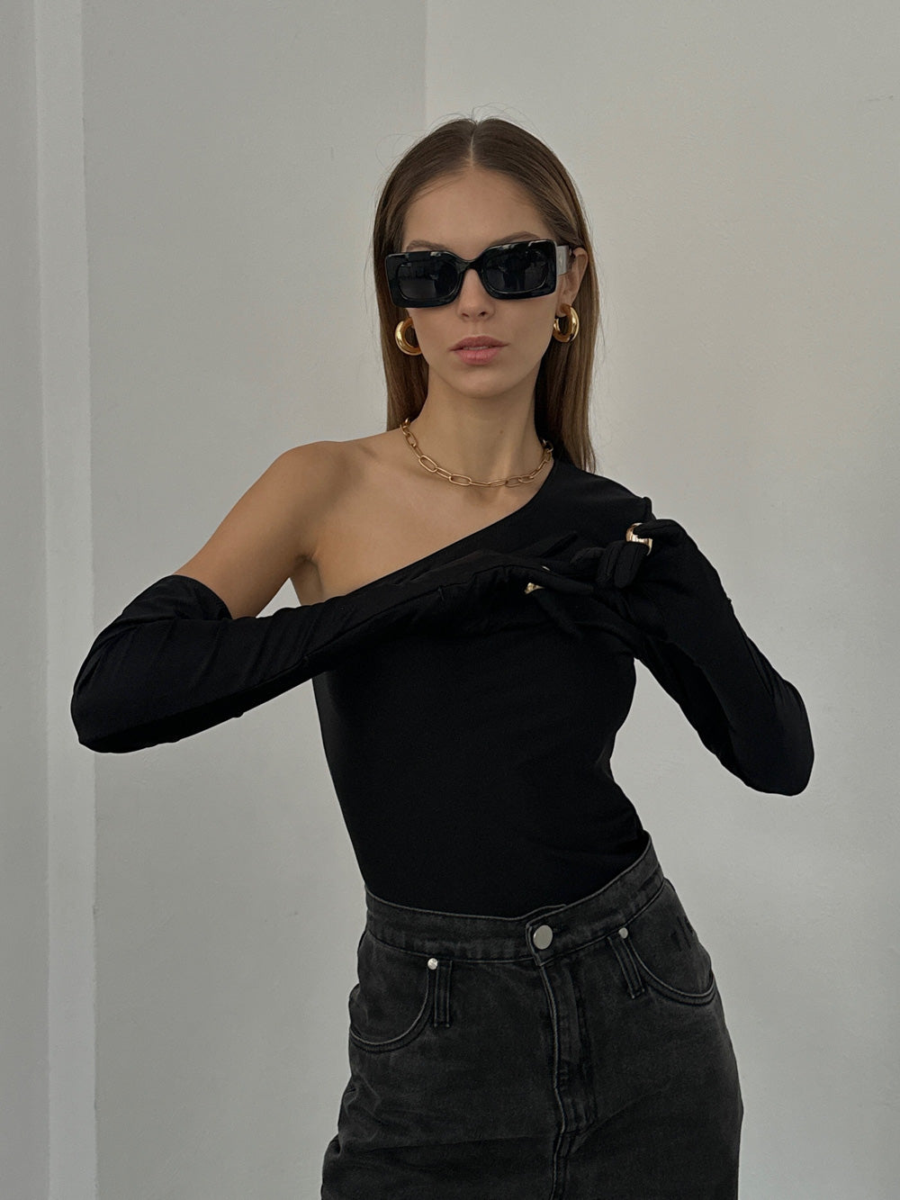 Top with glove on one shoulder