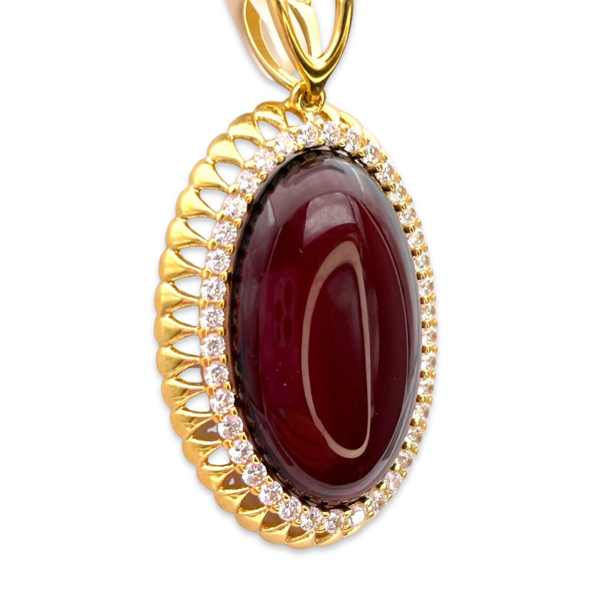 Gold-plated pendant with amber and zircons