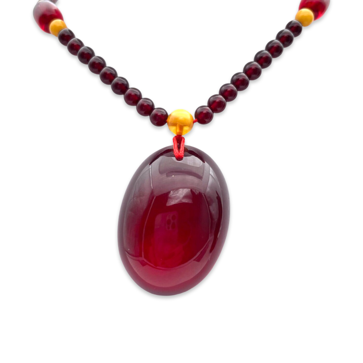 Red amber pendant with lens