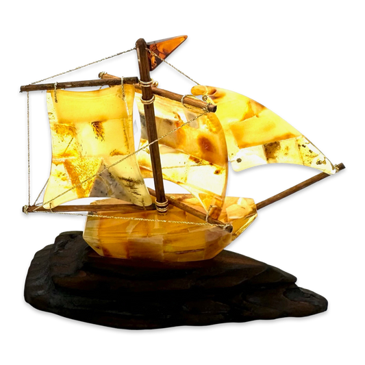 Amber souvenir on a wooden stand «Ship»