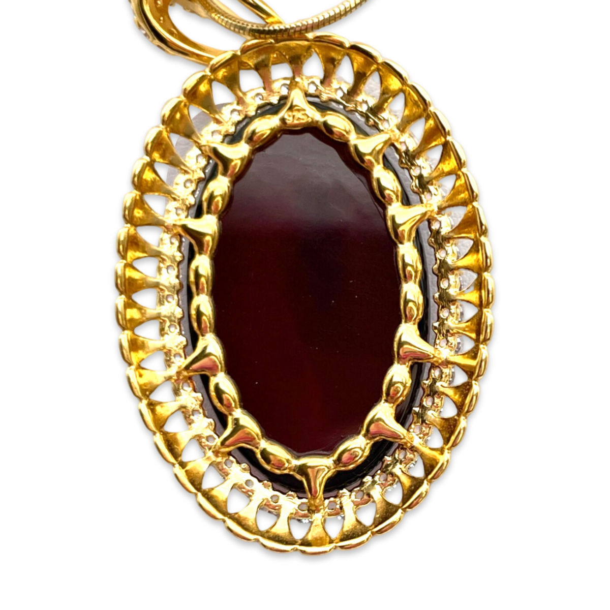 Gold-plated pendant with amber and zircons