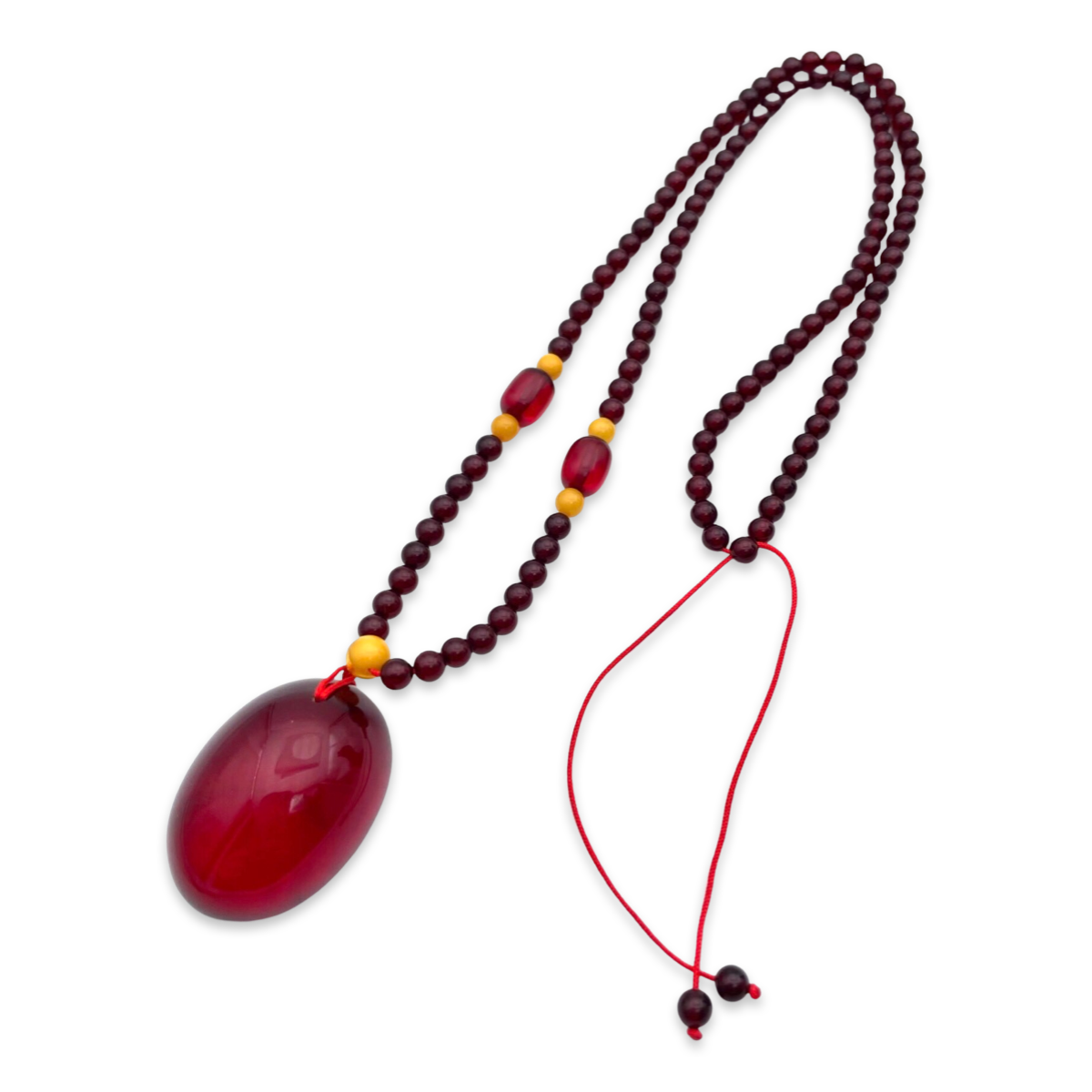 Red amber pendant with lens