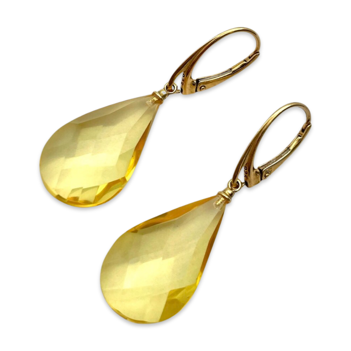 Gilded earrings with faceted amber