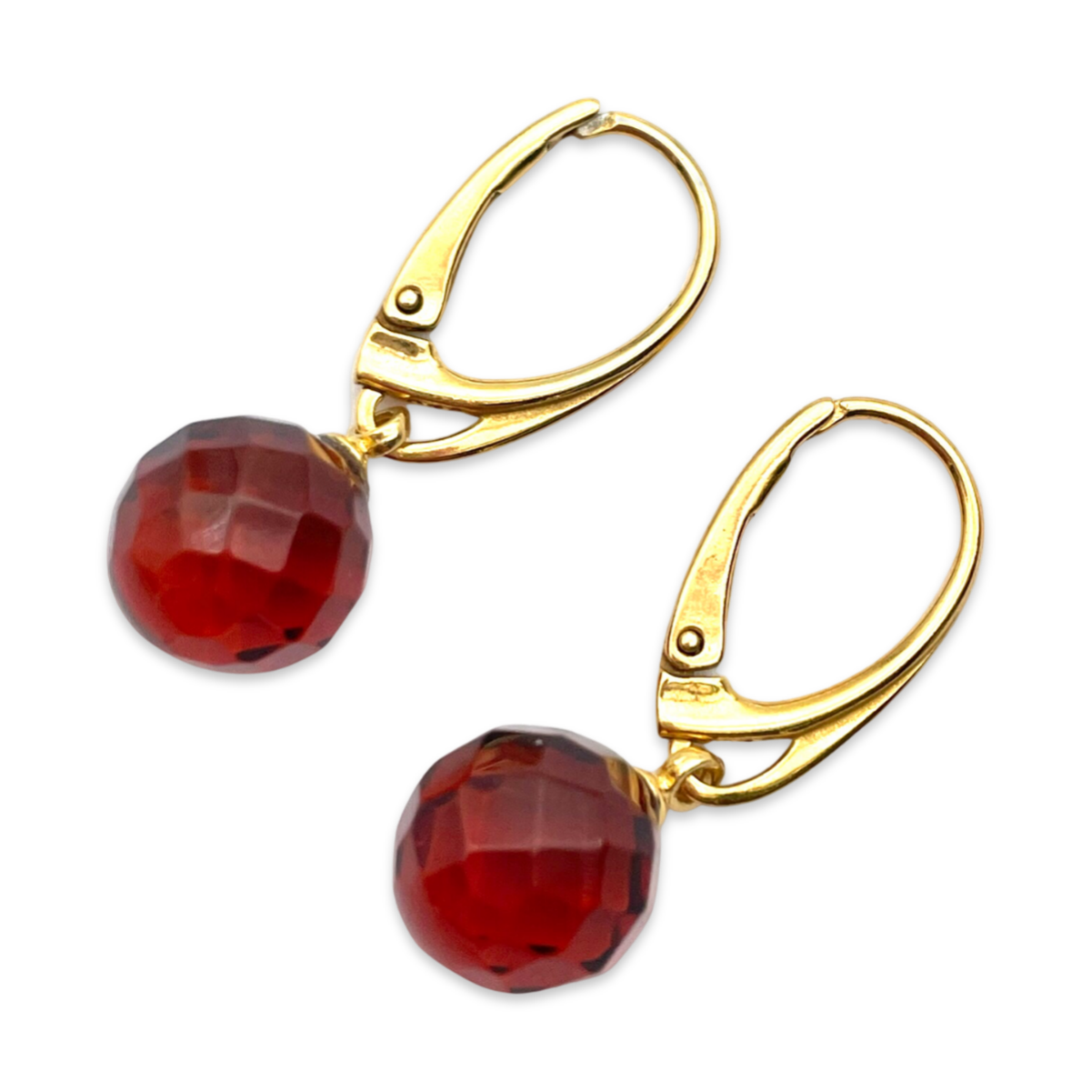 Gilded earrings with faceted amber