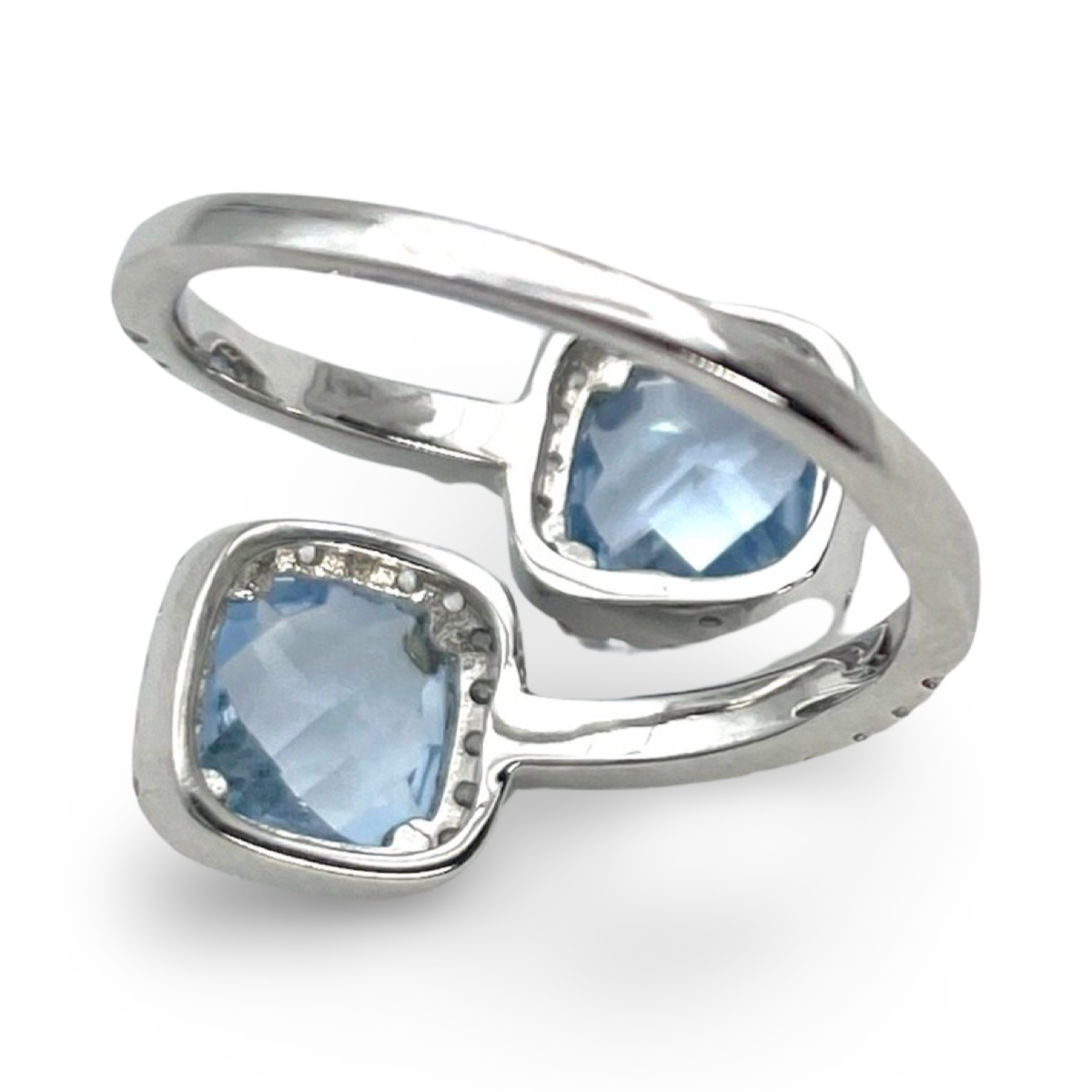 Silver ring with blue zircons