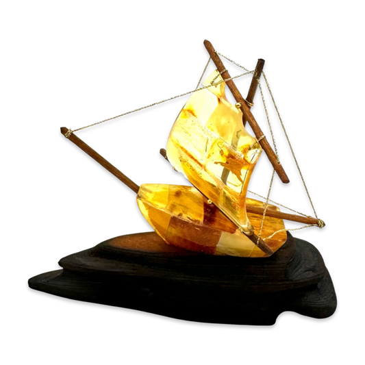 Amber souvenir on a wooden stand «Ship»