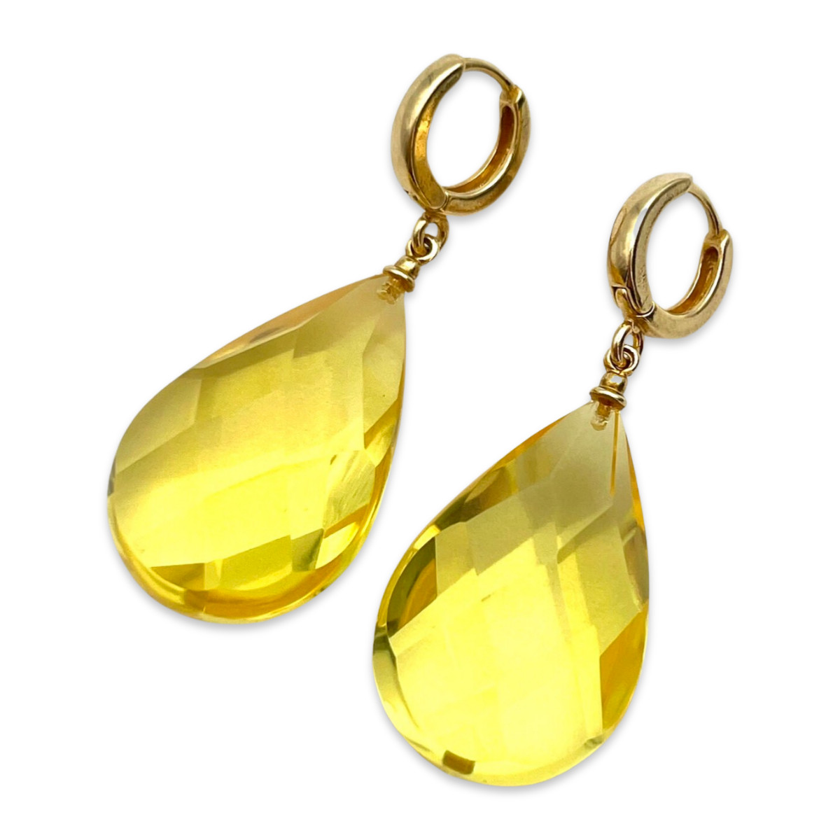 Gilded earrings with faceted amber