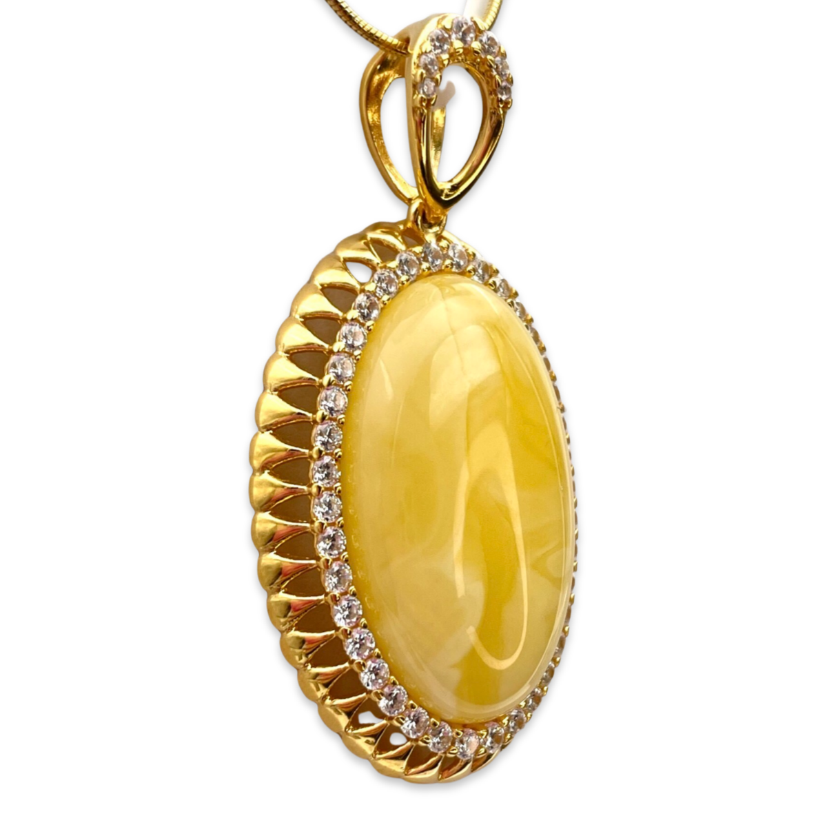 Gold-plated pendant with amber and zircons